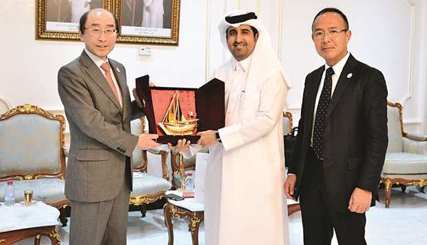 Qatar Chamber director general Saleh bin Hamad al-Sharqi and Shigeru Endo, the special envoy of the Japanese Ministry of Foreign Affairs for the Expo 2025, are seen during a token exchange ceremony held in Doha.