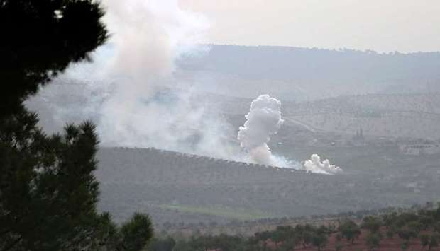 Smoke billows from the town of Sharran, which is controlled by Kurdish People's Protection Units (YPG), as Turkish-backed Syrian opposition fighters approach the area, north of the Syrian city of Afrin yesterday.