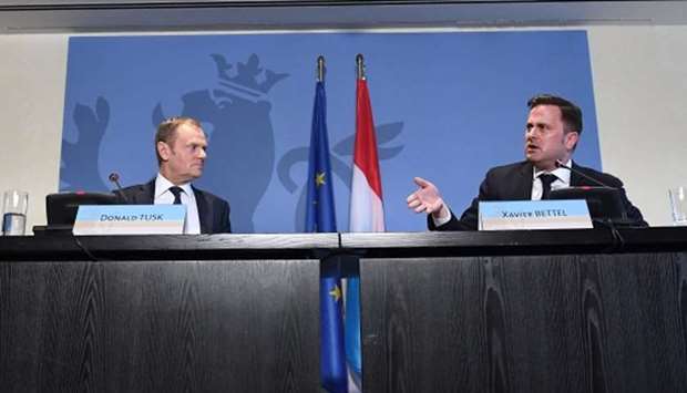 European Council President Donald Tusk (L) and Luxembourg's Prime Minister Xavier Bettel
