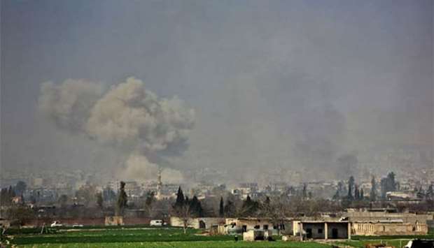 Smoke plumes rising following Syrian regime strikes on the village of Mesraba in Eastern Ghouta on Wednesday.