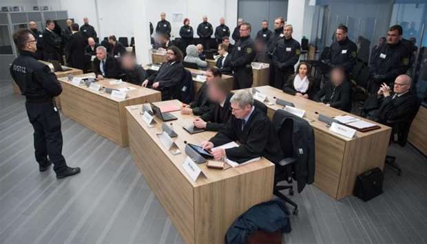 Defendants sit next to their lawyers at a courtroom in Dresden, eastern Germany, where members of the so-called ,Freital group, faced trial
