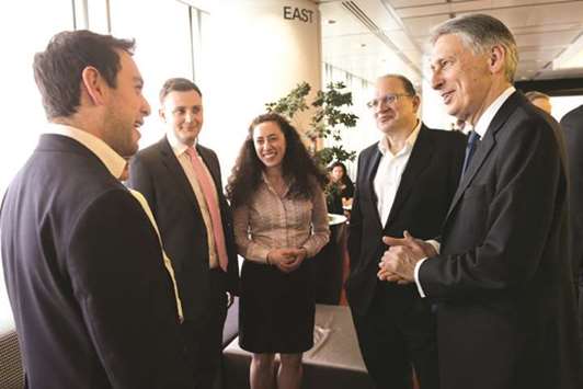 Chancellor of the Exchequer Philip Hammond meets trainees at HSBC headquarters at Canary Wharf in London yesterday before delivering a keynote speech on Brexit.