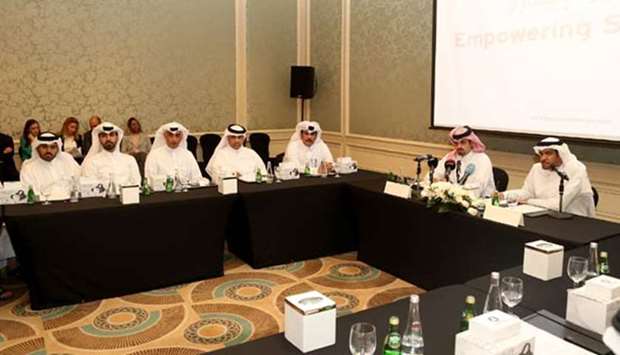 Barzan Holdings officials brief the media at a press conference on Wednesday.
