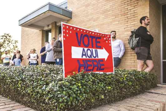 A line of early voters wait outside the Gardner Betts Annex in Austin, Texas.