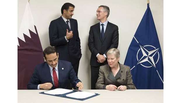 His Highness the Emir Sheikh Tamim bin Hamad al-Thani and Nato Secretary General Jens Stoltenberg witness the signing of the agreement in Brussels on Wednesday.