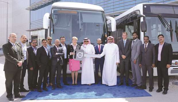 Officials and dignitaries at a ceremony marking the delivery of the buses.
