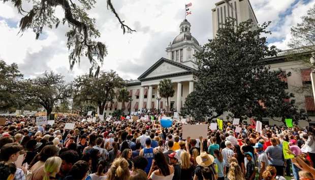 Protestors rally outside the Capitol urging Florida lawmakers to reform gun laws