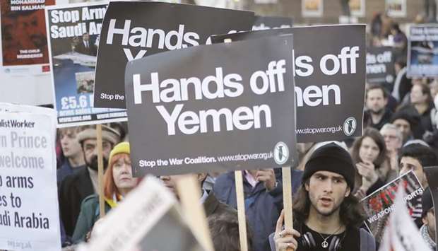 Protesters hold up pro-Yemeni placards as they demonstrate against UK arms sales to Saudi Arabia during the visit of Saudiu2019s Crown Prince Mohamed bin Salman, outside Downing Street, in central London, yesterday.