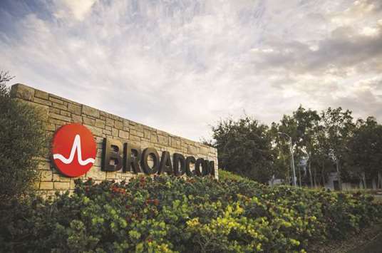 A signage is displayed outside Broadcom headquarters in Irvine, California. Broadcomu2019s deal to acquire Qualcomm is likely to be held up even beyond a rescheduled shareholder vote next month as government regulators undertake an extended review of the proposed transactionu2019s risks.