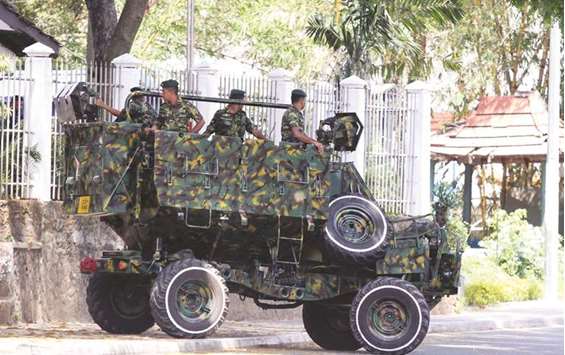 Sri Lankan army patrols the streets of Digana, a suburb of Kandy.