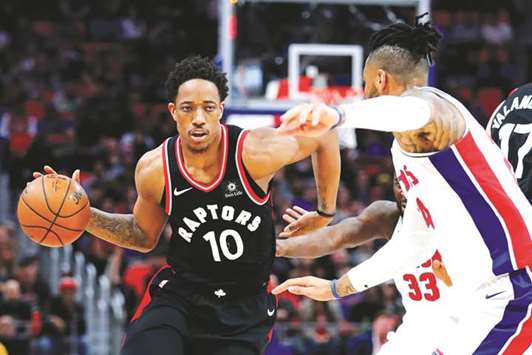 Toronto Raptors guard DeMar DeRozan (right) dribbles past Detroit Pistons forward Eric Moreland during their NBA game in Detroit. PICTURE: USA TODAY Sports
