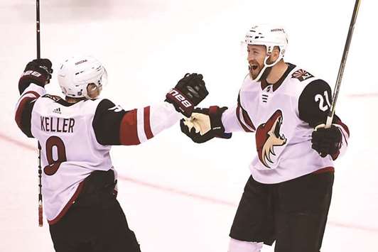 Arizona Coyotes forward Derek Stepan (right) celebrates his goal with forward Clayton Keller against Vancouver Canucks during their NHL game at at Rogers Arena. PICTURE: USA TODAY Sports