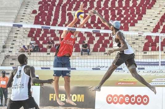 Qataru2019s Cherif Younousse (left) and Ahmed Tijan (right) in action during their match against Michal Bryl and Grzegorz Fijalek of Poland at the FIVB Katara Cup Beach Volleyball yesterday. PICTURES: Jayaram