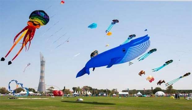 Kites of various sizes, shapes, colours and designs soar high above Doha's Aspire Park.
