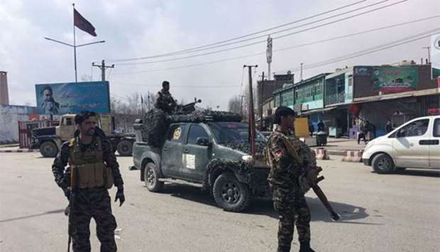Afghan security forces keep watch near the site of an explosion in Kabul on Friday.