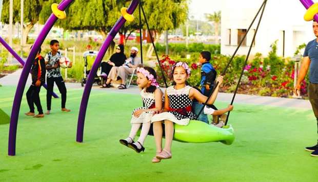 Children enjoy the swing. PICTURE: Jayan Orma..