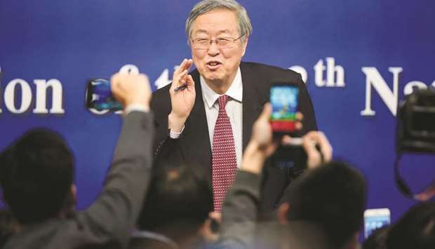 Zhou Xiaochuan, governor of the Peopleu2019s Bank of China, attends a news conference in Beijing yesterday. u201cWe now emphasise the new normal of the economy, shifting from the past growth model of quantitative growth to high quality growth,u201d Zhou said, in what was likely his last news briefing before his expected retirement this month.