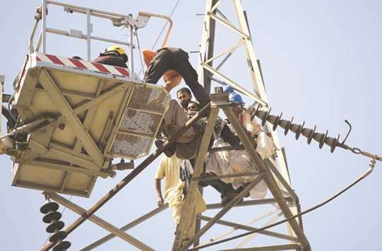 Police and emergency services personnel engage, and later rescue, a man who climbed a high tension pylon in Islamabad, in a suicide attempt as a protest for not receiving justice over the murder of his father. According to police, 22-year-old Hafiz Rizwan Younas wanted to commit suicide as he had given up on his familyu2019s efforts to seek justice over his fatheru2019s murder in 2006.