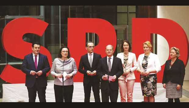 Nahles (second from left) presents Hubertus Heil (as designated labour minister), Fraziska Giffey (family minister), Heiko Mass (third from left, foreign minister), Katarina Barley (justice minister), Svenja Schulze (environment minister) and Olaf Scholz (centre, finance minister) for the new government during a news conference at the SPD party headquarters in Berlin.