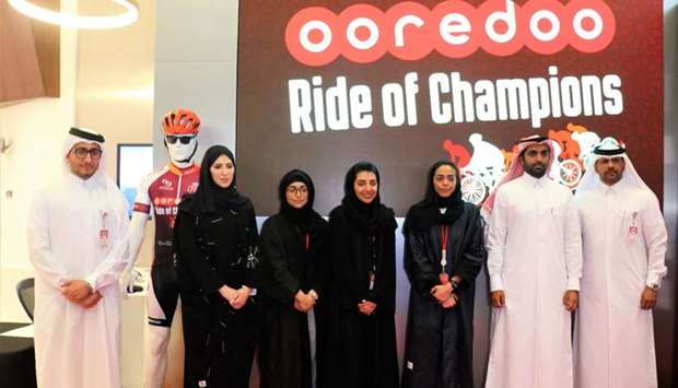 Officials representing Ooredoo and the event organisers mark the occasion.