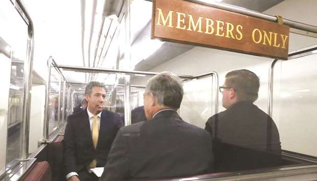 Michael Cohen, the former personal attorney of President Donald Trump, rides an underground subway to the US Capitol as he arrives to testify before a closed hearing of the House Intelligence Committee on Capitol Hill in Washington, US, yesterday.