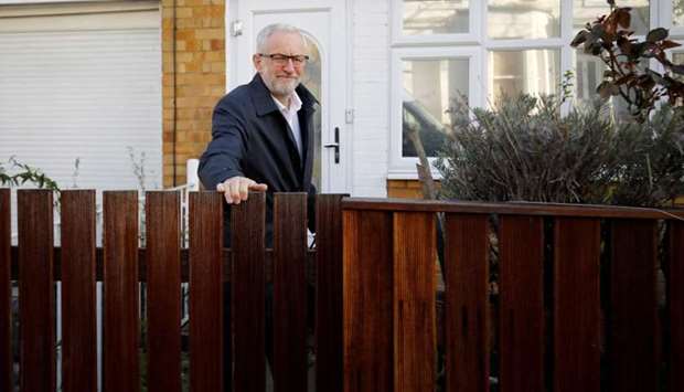 Britain's opposition Labour party leader Jeremy Corbyn leaves his house in north London