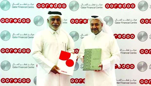 Ooredoo COO Yousuf Abdulla al-Kubaisi and QFC Authority CEO Yousuf Mohamed al-Jaida signed the MoU at Ooredoou2019s West Bay headquarters in the presence of several senior executives from Ooredoo and QFC.