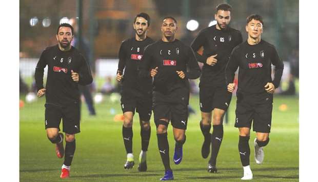 Al Sadd captain and midfielder Xavi Hernandez (left) is back in training, but is a doubtful starter for todayu2019s AFC Champions League group stage match against Persepolis at Jassim bin Hamad Stadium. PICTURE: Anas al-Samaraee