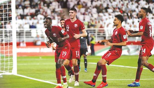 In this January 29, 2019, picture, Qataru2019s Almoez Ali (left) celebrates with his teammates after scoring a goal against the United Arab Emirates in their AFC Asian Cup semi-final in Abu Dhabi. (Reuters)