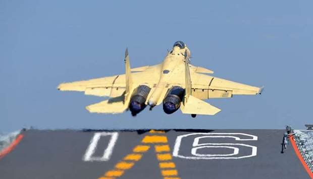 A Chinese navy fighter jet taking off from an aircraft Carrier.