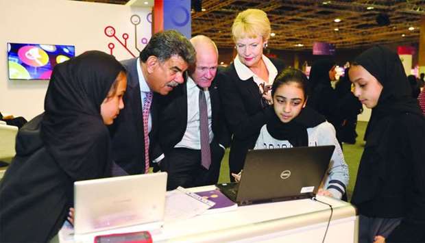 Dr Abdul Sattar al-Taie, Executive Director, QNRF, views a studentu2019s project at the exhibition.rnrn
