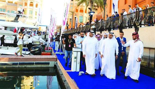 HE the Minister of Commerce and Industry Ali bin Ahmed al-Kuwari tours the Qatar International Boat Show on Tuesday at the Porto Arabia Marina at The Pearlu2013Qatar along with other dignitaries.
