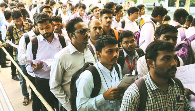 Job seekers line up for interviews at a job fair in Chinchwad, India, in this February 7, 2019, photo.