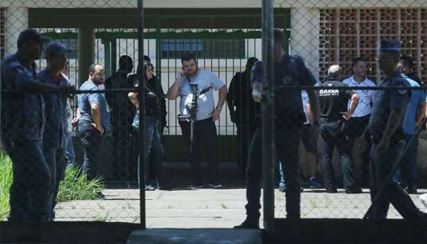 Policemen are seen at the Raul Brasil school after a shooting in Suzano, Sao Paulo state, Brazil