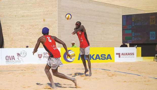 Qatar players Cherif Younousse and Ahmed Tijan in action durigg their Pool A match against Omanu2019s Nouh al-Jalbubi and Mazin al-Hashmi at the FIVB Beach Volleyball World Tour Katara Cup 2019 yesterday.