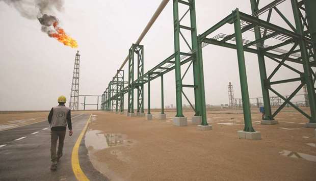 An employee walks at the Hammar Mushrifu2019s new Degassing Station Facilities site inside the Zubair oil and gas field, north of the southern Iraqi province of Basra. One of the sources familiar with SOMOu2019s thinking said the firm was looking at how best to deploy the knowledge of its u201cseconded teamu201d u2014 SOMO employees who had worked in the trading JVs.