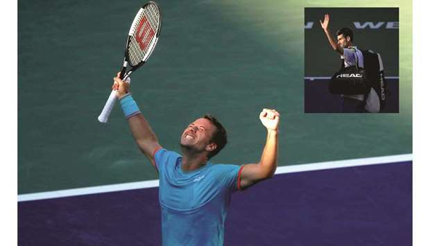 Philipp Kohlschreiber of Germany celebrates his victory over Novak Djokovic (inset) of Serbia during their menu2019s singles third round match in the BNP Paribas Open in Indian Wells, California, on Tuesday. (AFP)