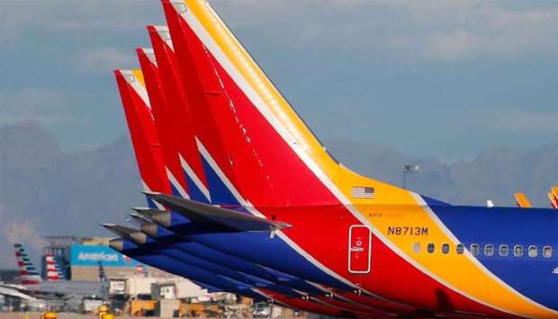 A group of Southwest Airlines Boeing 737 MAX 8 aircraft sit on the tarmac at Phoenix Sky Harbor International Airport 