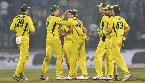 Australian players celebrate a wicket during the fifth ODI against India in New Delhi on Wednesday. (AFP)