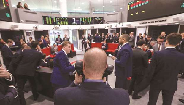 Traders react on the trading floor of the open outcry pit at the London Metal Exchange. Plans by the LME to launch a European steel contract are likely to be delayed until next year because the industry wants it to be priced in euros, which the exchangeu2019s clearing house cannot process, industry sources say.