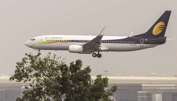 A Boeing 737 aircraft operated by Jet Airways approaches to land at Chhatrapati Shivaji International Airport in Mumbai. The airline, once one of Indiau2019s leading carriers, has piled up more than $1bn in debt and failed to pay banks, employees and lessors on time, resulting in close to half its fleet being grounded.