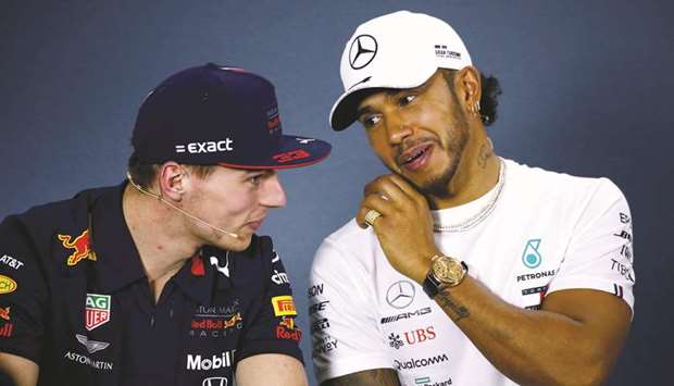 Mercedesu2019 Lewis Hamilton (right) with Red Bullu2019s Max Verstappen during a press conference in Melbourne yesterday. (Reuters)