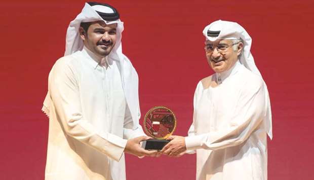 Qatar Olympic Committee (QOC) president HE Sheikh Joaan bin Hamad al-Thani (left) honours His Highness Sheikh Abdullah bin Khalifa al-Thani, the first QOC president, yesterday.