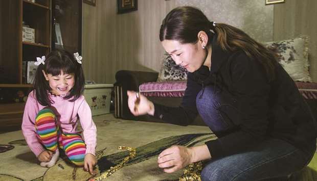 Amina playing with her mother Naranchimeg in Bornuur Sum, a village 135km away from Ulaanbaatar, the capital of Mongolia.