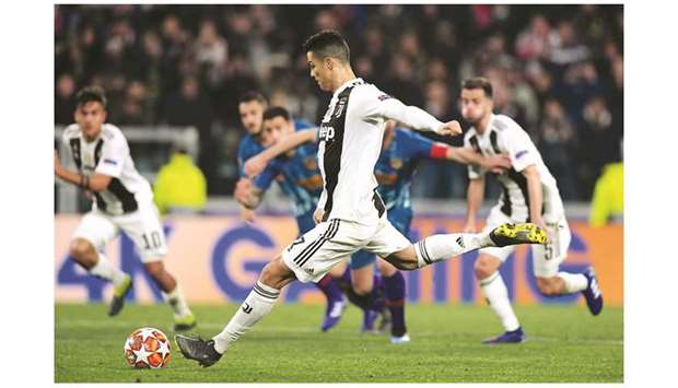 Juventusu2019 Cristiano Ronaldo scores a goal against Atletico Madrid during their Champions League match in Turin, Italy, on Tuesday. (Reuters)