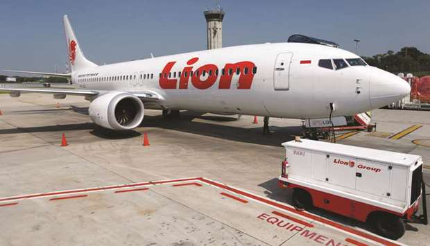 Lion Airu2019s Boeing 737 Max 8 airplane is parked on the tarmac of Soekarno Hatta International airport near Jakarta. On Wednesday, the US joined a wave of nations grounding the 737 MAX in the wake of Sundayu2019s crash in Ethiopia, which killed all 157 people onboard.