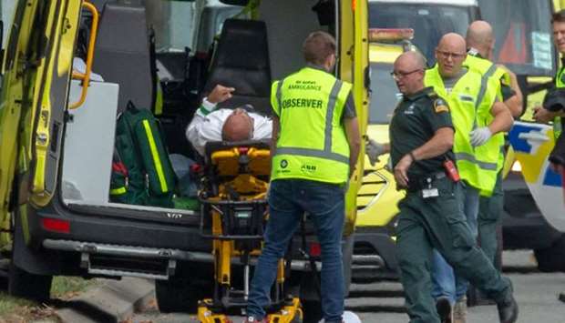 An injured person is loaded into an ambulance following a shooting at the Al Noor Mosque in Christchurch, New Zealand.