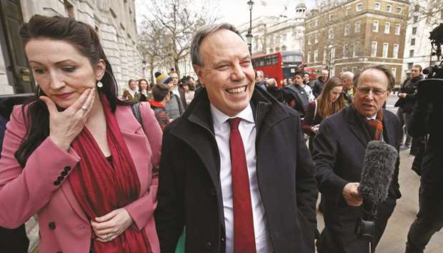 Democratic Unionist Party (DUP) deputy leader Nigel Dodds, leaves after speaking to the media outside the Cabinet Office, in London yesterday.
