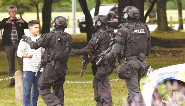AOS (Armed Offenders Squad) push back members of the public following a shooting at the Al Noor Mosque in Christchurch.