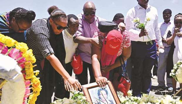 Families of victims from Kenya and Rwanda lay flowers yesterday, as they visit the crash site of the Ethiopian Airlines operated Boeing 737 MAX aircraft which killed 157 passengers and crew onboard, at Hama Quntushele village, near Bishoftu, in Oromia region.